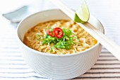 Red curry with noodles, fresh chillis, spring onions and lime (Thailand)