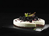 Cheesecake with blackberries, sliced