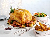 Traditional roast turkey with roast potatoes, carrots and sprouts (Christmas)