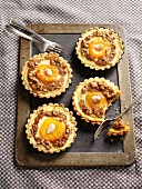 Quark tartlets with peaches and almonds