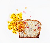 A slice of ricotta cake with cranberries, oranges and passionfruit sauce