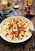 Pineapple carpaccio with pomegranate seeds