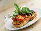 Bruschetta with tomatoes, mushrooms and poached egg