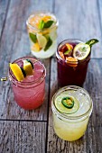Four different refreshing glasses of lemonade