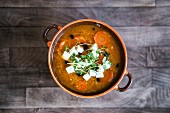 Lentil soup with carrots, feta cheese and cress
