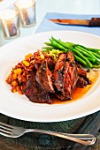 Beef steak with red rice and green beans