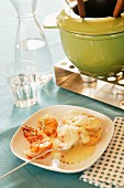 Cheese fondue with prawns and bread