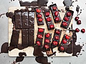 Dark chocolate cake with cherries, sliced