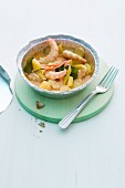Prawn curry with pineapple in an aluminium dish