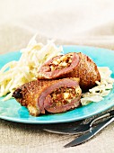 Stuffed duck roulade with white cabbage