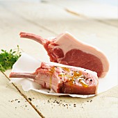 Fresh pork chops with olive oil and pepper