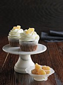 Chocolate cupcakes with candied ginger on a mini cake stand
