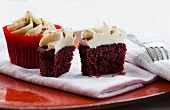 Red Velvet cupcakes topped with a light cream