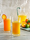 Various glasses of lemonade (mandarin, mandarin & orange, and orange)