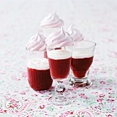 Strawberry shots with cream and meringues