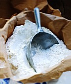 Flour in a paper sack with a scoop