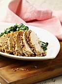 Steamed chicken breast with a sesame seed coating (Asia)