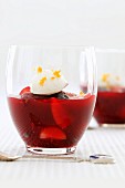 Red fruit jelly with a dollop of cream