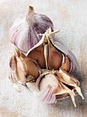 Two bulbs of garlic, one opened