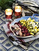 Herring salad with gherkins, eggs and beetroot for Christmas