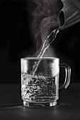 Hot water being poured into a glass