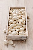 Pearl onions in a wooden crate