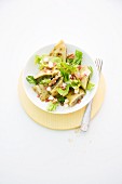 Maultaschen (Swabian ravioli) salad with pears and bacon