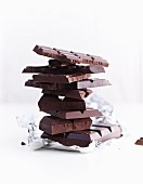 A stack of chocolate pieces on silver foil