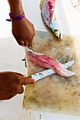 Ceviche being made: fish being filleted