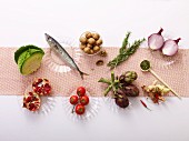 Various anti-inflamatory foods on glass plates seen from above