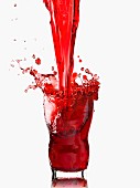 Cherry juice being poured and splashing