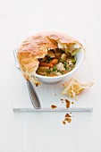 Chicken fricassee with a puff pastry lid