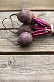 A bunch of beetroot on a wooden table