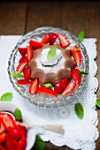 Chocolate pudding with cream and strawberries