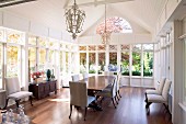 Elegant dining area in spacious, conservatory-style salon