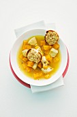 Pumpkin soup with chicken and baguette