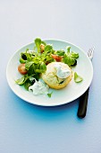A muffin with tzatziki and salad