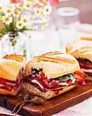 A submarine sandwich with salami and ham