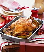Roast chicken with onions and apple