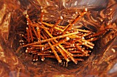 A bag of pretzel sticks (seen from above)