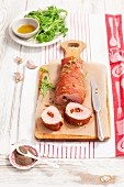 Stuffed pork fillet with dried tomatoes and gorgonzola wrapped in Proscuitto