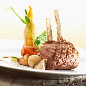 A lamb chop with herb butter and grilled chicory