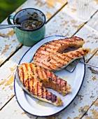 Grilled salmon steaks in pastis with tapenade