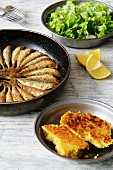 Fried Atlantic horse mackerel with cornbread and salad