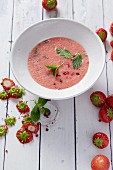 Strawberry soup with pink pepper and mint