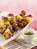 Potato skewers with radishes and pesto