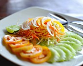 Vegetable salad with tomatoes, cucumber and grated carrots