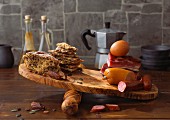 Bread, meat, eggs and sausage on a chopping board