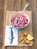 Herring salad with beetroot, onions apple and mayonnaise