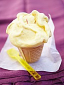 Soft-serve saffron ice cream in a cone